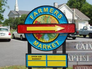 A farmers market sand carved sign made by A Signco in Conover, North Carolina.